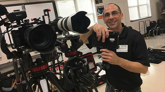 Videograher with his Cameras